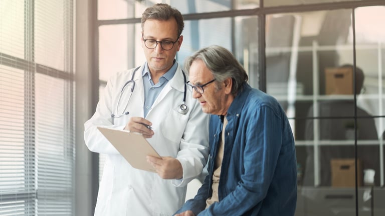 Doctor talking with a patient during a consultation at Kennedy Health Center in Wilmington, Delaware